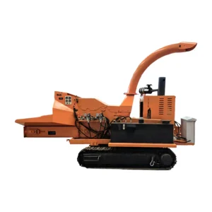 Heavy duty self-propelled tracked wood chipping machine processing large branches, logs, and wood waste in forestry and biomass applications