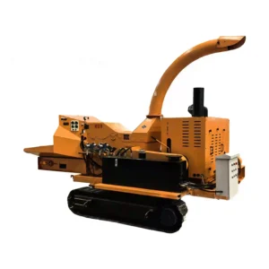 Large tracked wood shredder processing logs, branches, and heavy wood waste with crawler mobility for forestry and biomass recycling